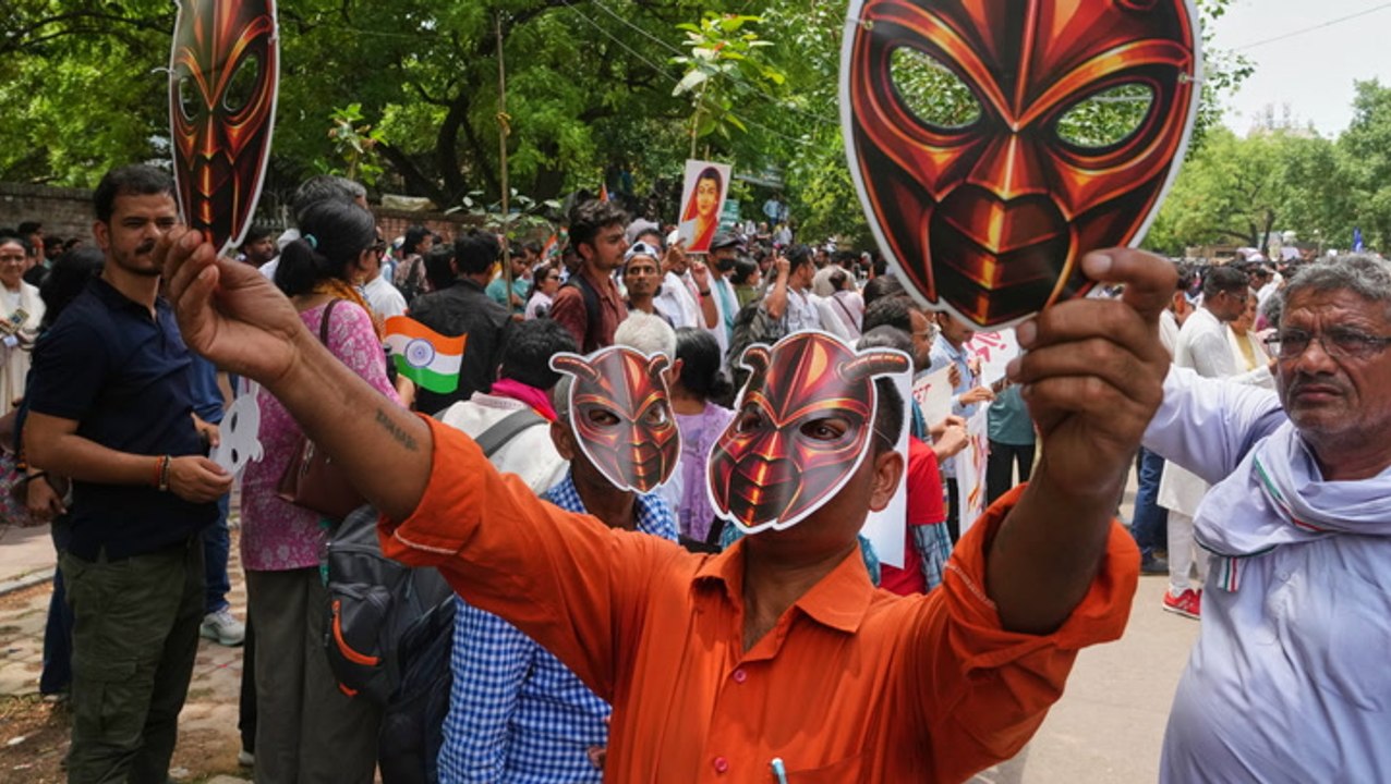 Hundreds don masks as supporters of India’s viral ‘Cockroach People’s Party’ stage first protest