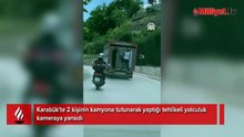 Canlarını hiçe sayıp kamyonun kasasına tutundular! Tehlikeli anlar kamerada