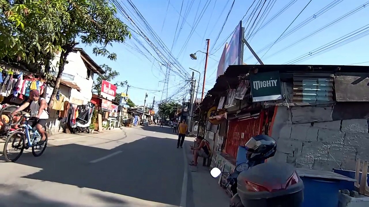 Walks Further on Que Balag Street in Valenzuela City in the Philippines
