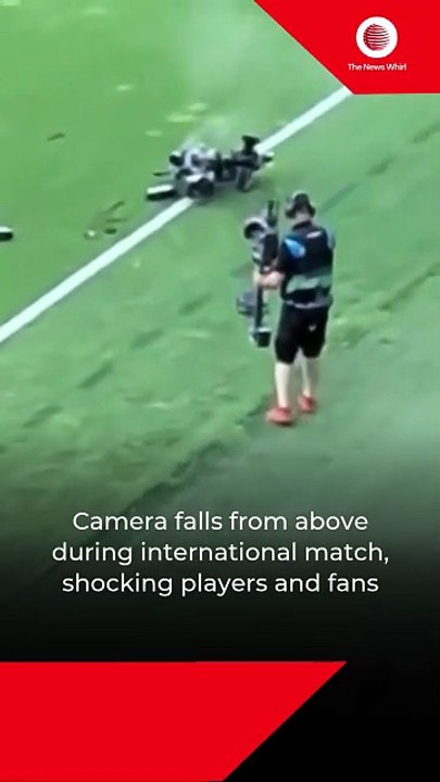 Camera falls from above during international match