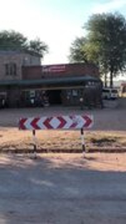 Elephant Walks Through Village Street