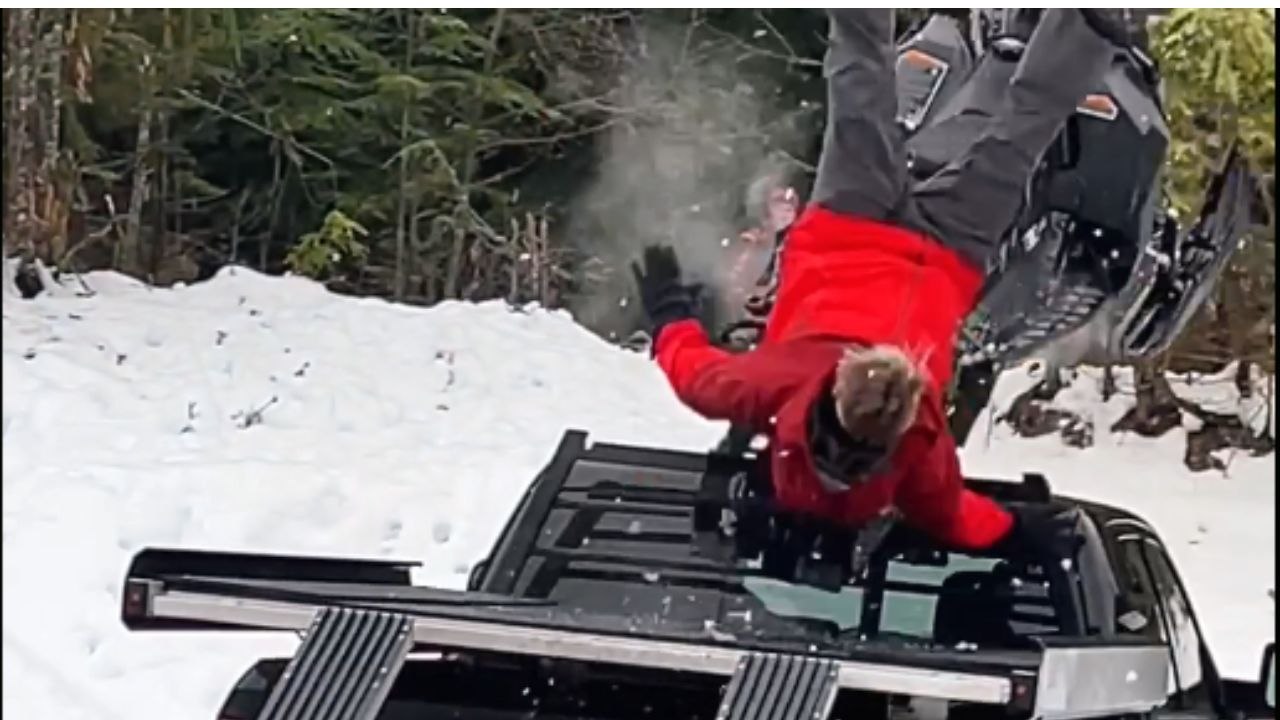 Hilarious Snowmobile fail - Clever guy tries to load snowmobile on the truck using ramp