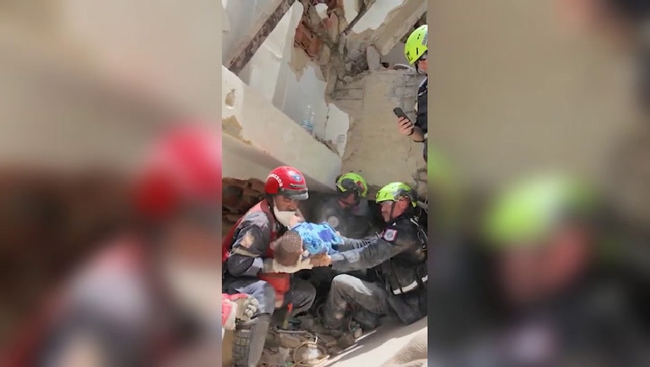 Rescue teams pull baby alive from beneath rubble after earthquake in Venezuela