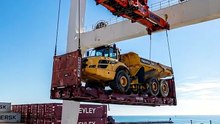 Giant Port Crane Lifts a Massive Dump Truck Onto a Cargo Ship! 🚢🏗️