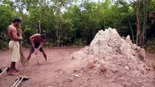Building underground hut with grass roof  fireplace with clay