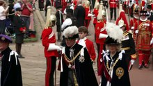 King and Queen smile as they arrive at Order of the Garter