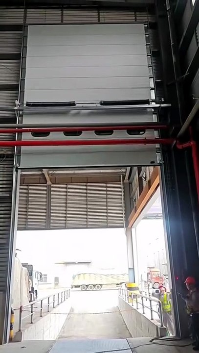 Dock shelter compatible high-speed doors integrated with existing dock shelters.