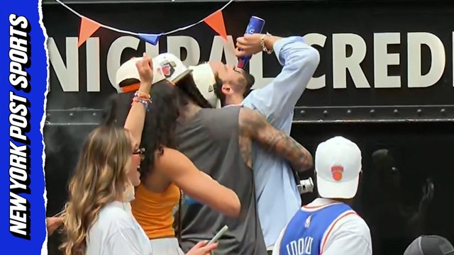 Landry Shamet chugs beer at Knicks championship parade.
