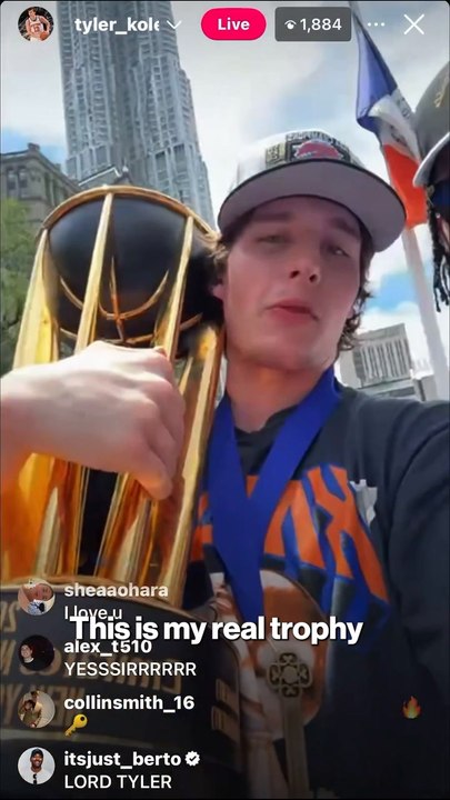 Tyler Kolek celebrates with the NBA Cup at Knicks parade