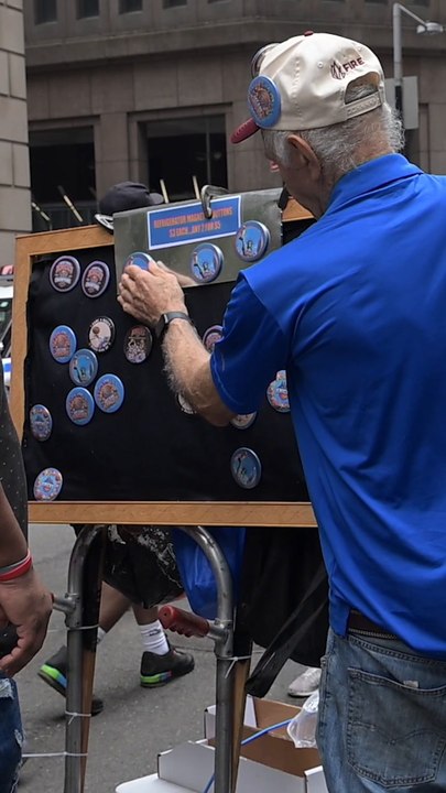 Street vendors sell Knicks merchandise at parade