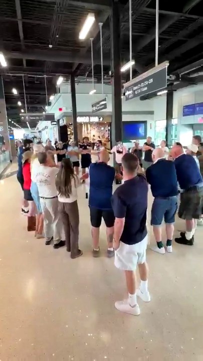 Tartan Army fans from far north perform Loch Lomond at Nashville airport