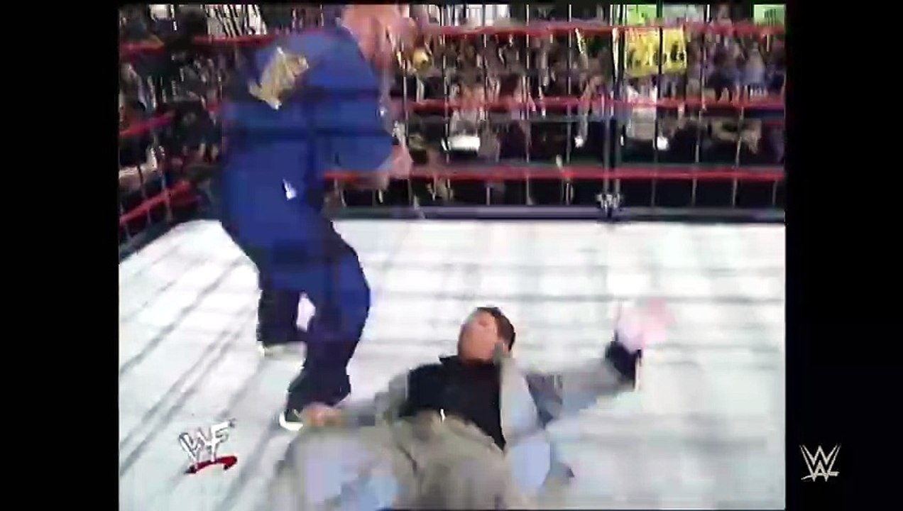 Stone Cold Steve Austin disguises himself as a cameraman to launch a sneak attack on Mr. McMahon