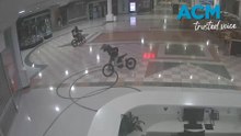 CCTV shows trio allegedly riding e-motorbikes inside Canberra shopping centre