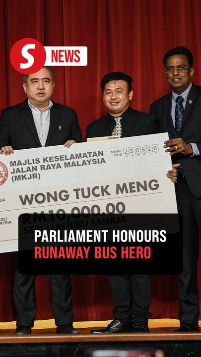 Lorry driver who saved 21 bus passengers honoured at Parliament