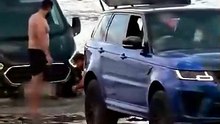 Moment £120k Range Rover is submerged by rising tide after owner gets stuck