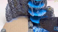Recycled Carton Crafts Become A Small House And Waterfall