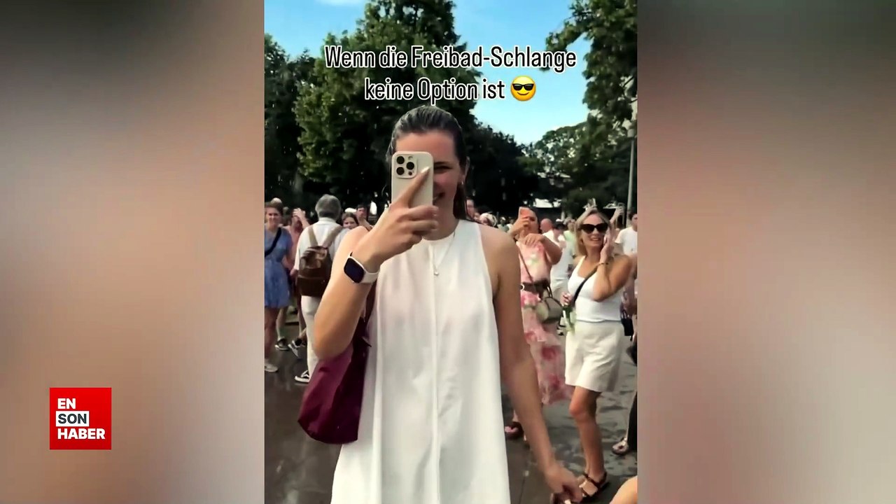 Almanya'da polis sıcaktan bunalan insanları tazyikli suyla serinletti