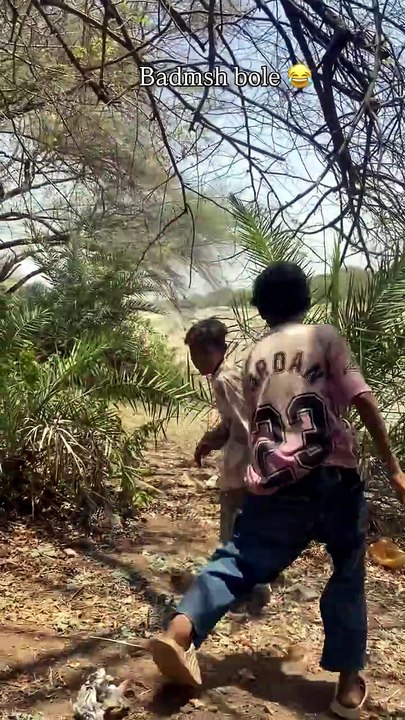 Two children engaged in a playful fight during an argument, expressing strong emotions with raised voices and animated gestures. The scene captures a common childhood disagreement, emphasizing conflict without serious harm.