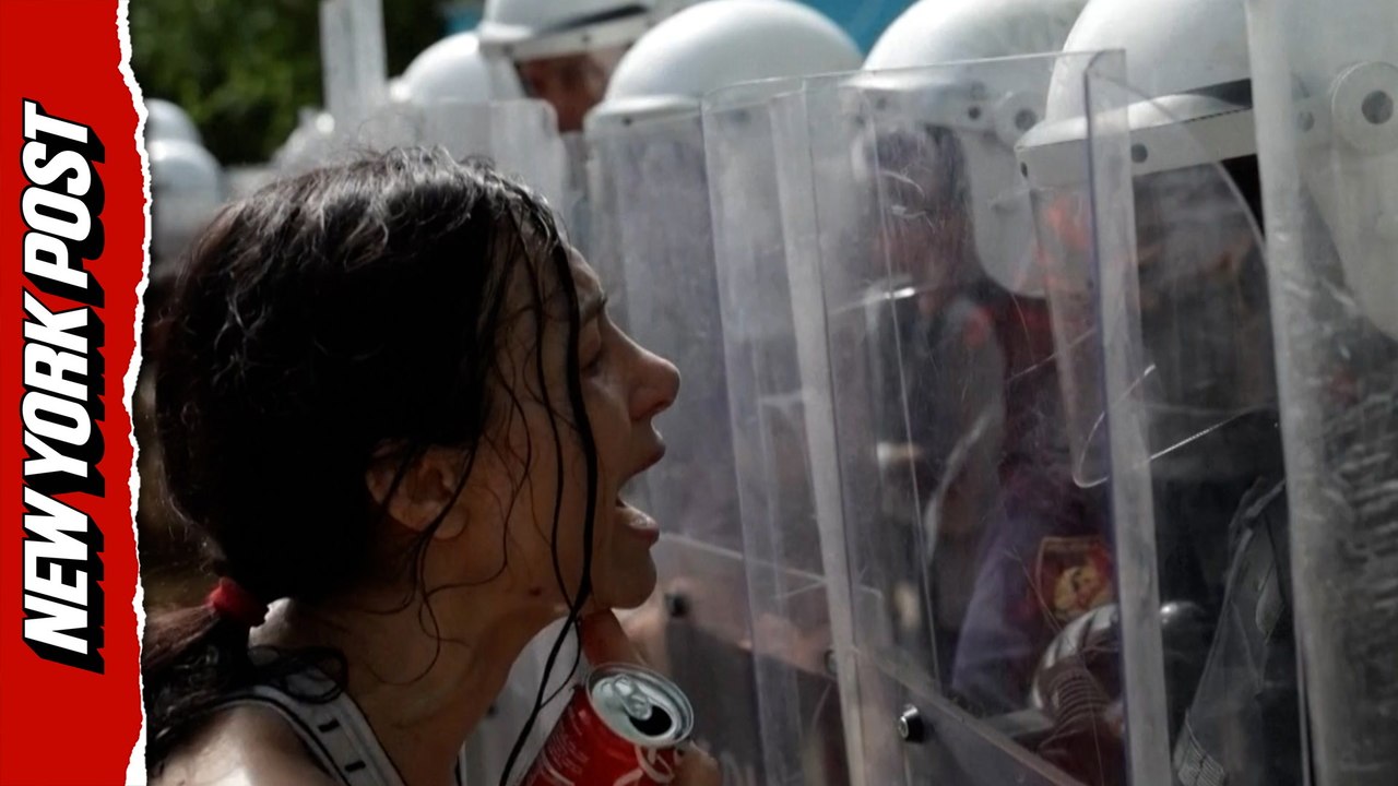 Chaos ensues as police deploy water cannons and tear gas against Albanian protesters