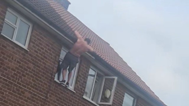 Heart-Stopping Moment: Boy Balances on Roof Edge as Officers Observe