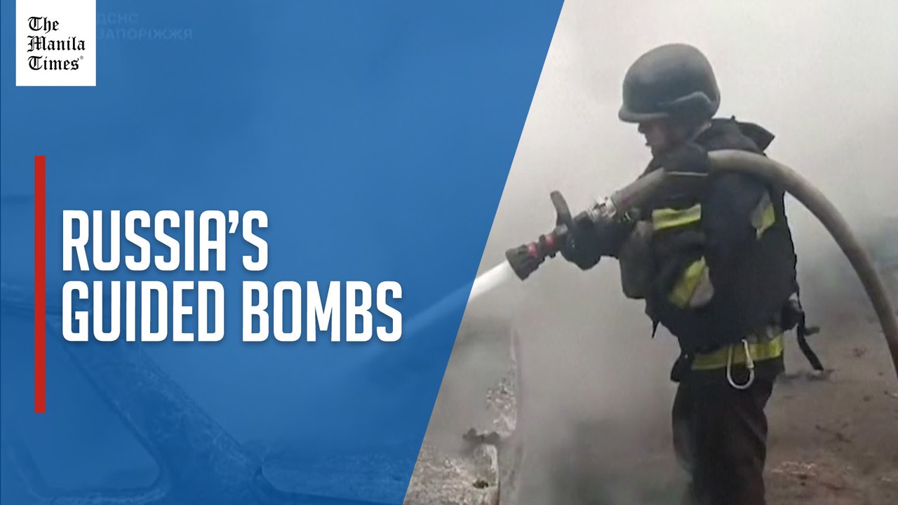 Firefighters extinguish burning cars after Russian guided bomb strike