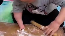 Little kid with amputated hand making dumplings!