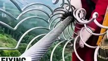 Look at this guy repairing electric wires high above the ground!