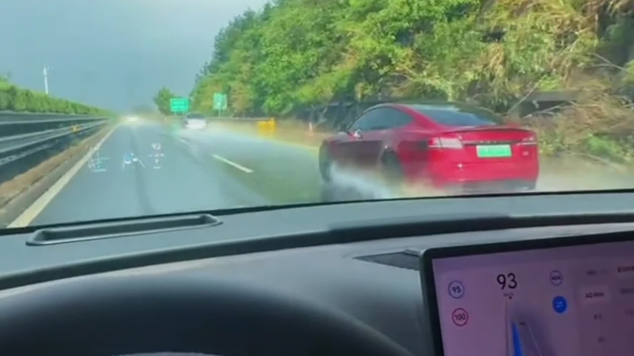 Tesla Appears to Leave Rainbow Trail on Rain-soaked Highway