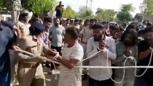 13 साल की मासूम बच्ची के बलात्कारियों को सार्वजनिक रूप से पिटते हुये जेल ले जा रहे है इससे अच्छा इन हरामखोर की पैदाइशो को सरेआम चौराहे पर लटकाते ओर प्राईवेट पार्ट ओर दोनो हाथ काटकर खुला छोड़ देते -------- ये सजा सबके लिए सबक होती जो बच्चियों को हवस के रूप