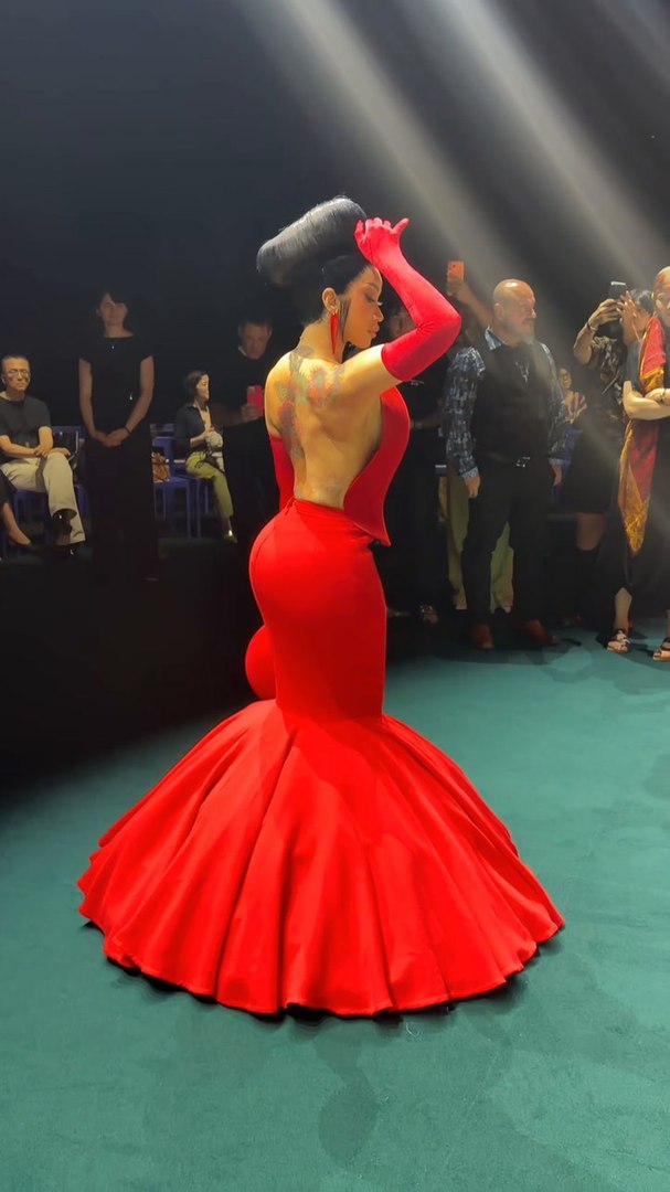 cardi b red dress opened her show in a stunning detailed dress. The Little Miss Drama Tour is on another level.  Cardi B Wears a Massive