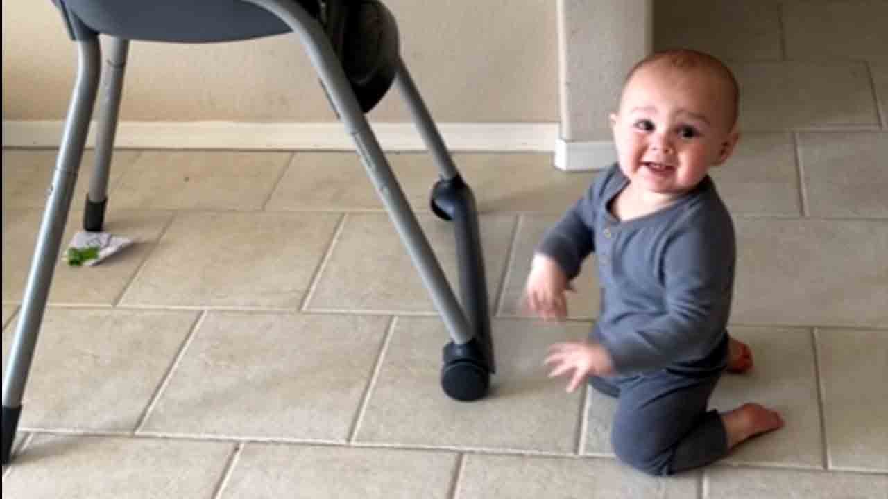 Adorable baby boy crawls toward mommy's treadmill and dances to her workout song
