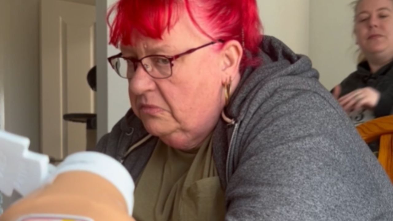 Man Squeezes Sauce Bottle And It Sprays Onto A Woman’s Face