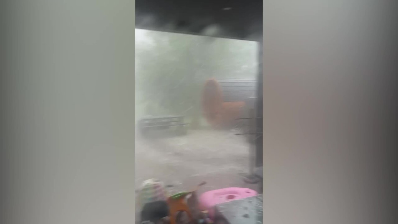Man Caught in Sudden Hailstorm During Extreme Weather