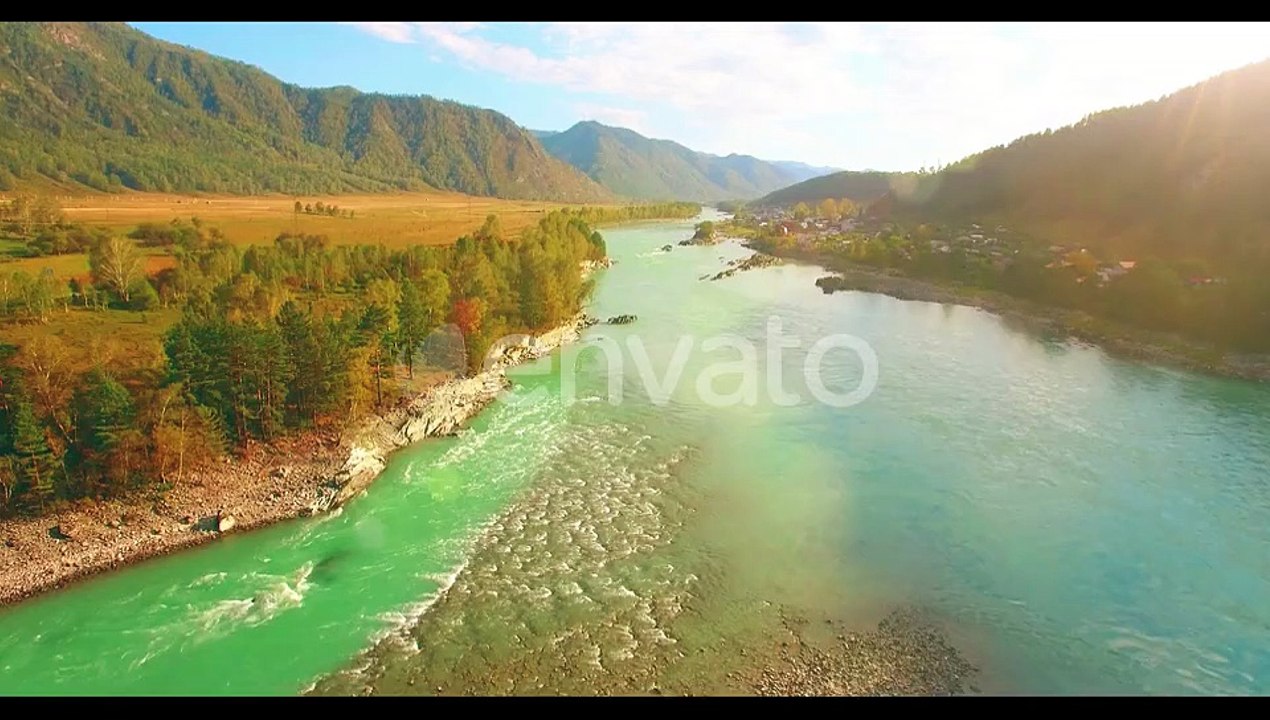 Low Altitude Flight Over Fresh Fast Mountain River with Rocks at Sunny Summer Morning.