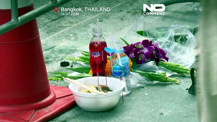 Flowers and forensic teams at Bangkok bar where deadly fire killed at least 27