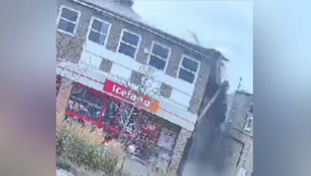 Masonry rains down on busy high street as roof...