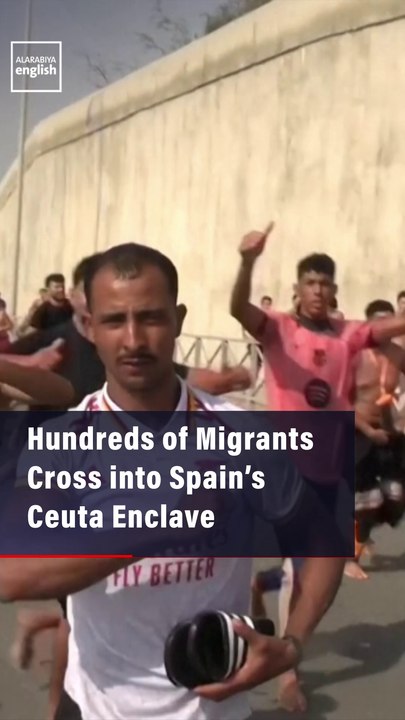 Hundreds of Migrants  Cross into Spain’s Ceuta Enclave