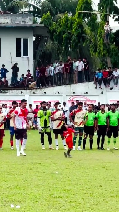 At a young age, this young man played football so well that a crowd of spectators gathered to watch.