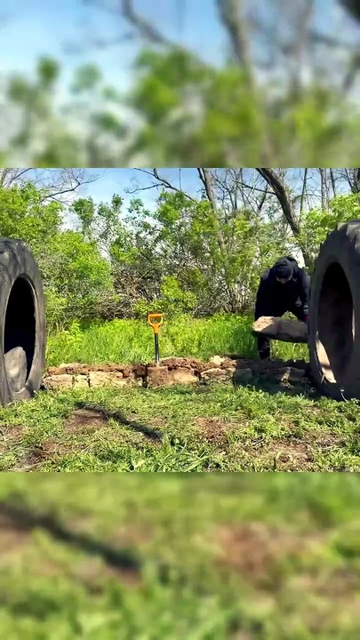 Building a bushcraft shelter from tractor wheel...