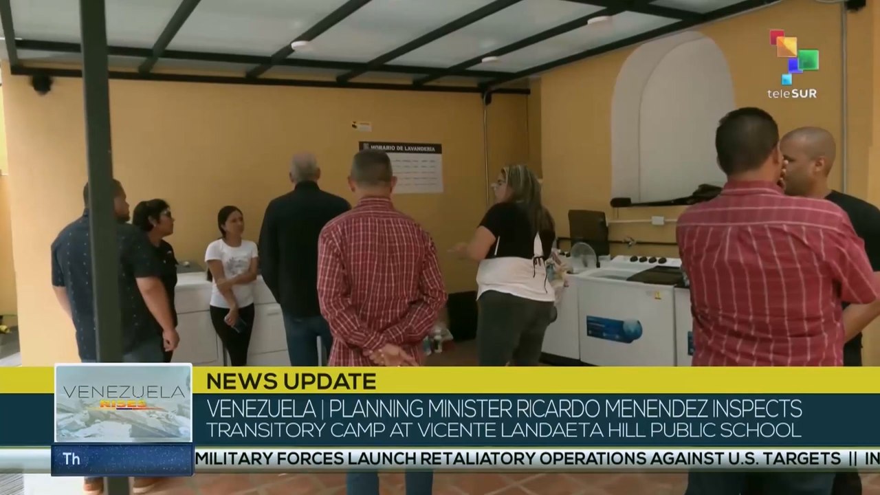 Planning Minister Ricardo Menendez inspects transitory camp at Vicente Landaeta hill public school