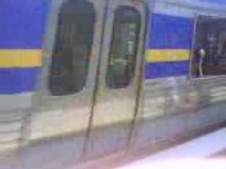 TRAIN PULLING IN TO RESERVOIR STATION IN MELBOURNE