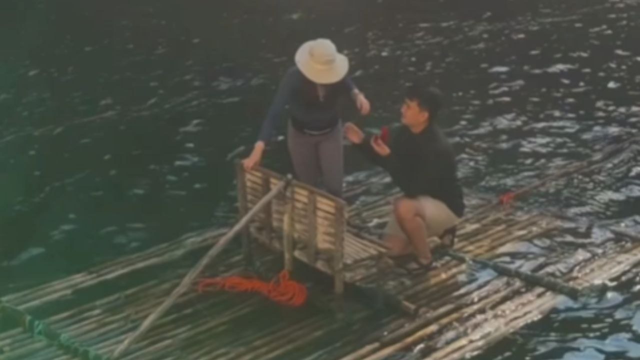 Man Kneels Before A Girl At Aw-Asen Falls