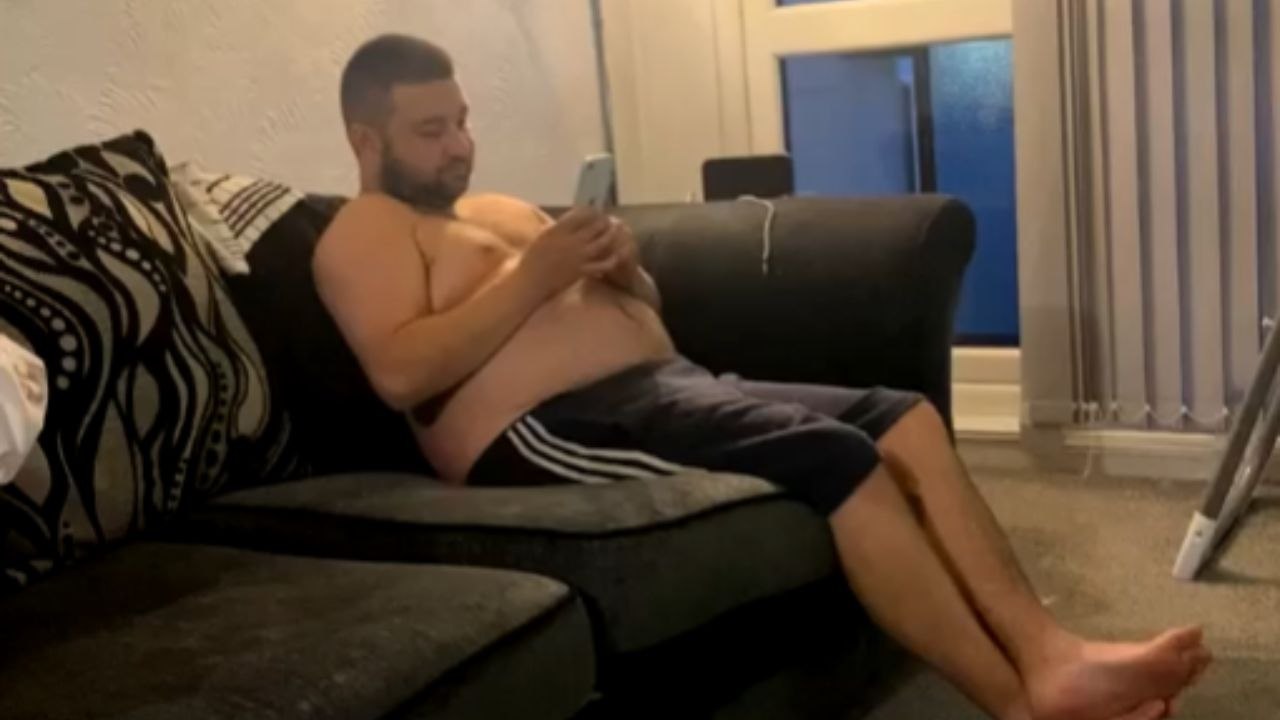 Man Boogies In A Living Room As Music Plays