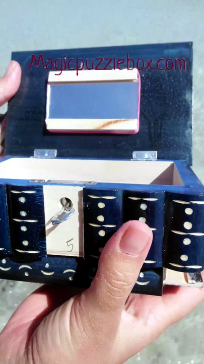 Hidden key secret storage box revealed at La Pelosa Beach Sardinia Italy