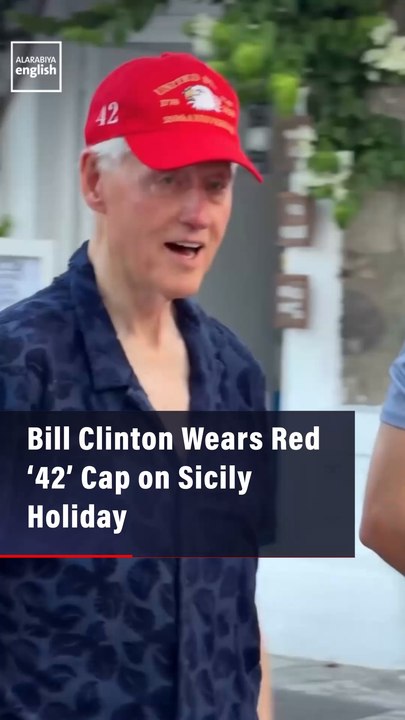 Bill Clinton Wears Red ‘42’ Cap on Sicily Holiday