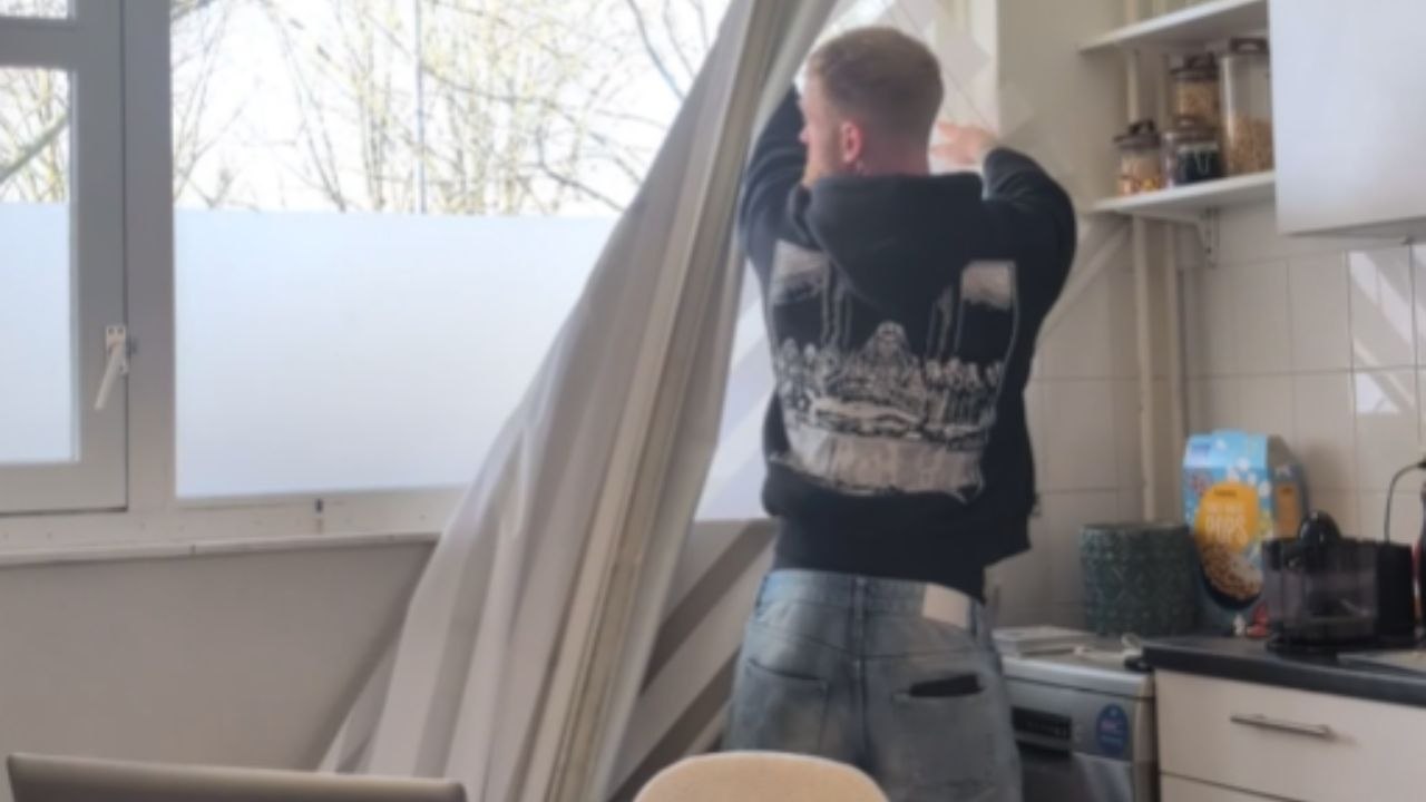 Boy Pulls Down A Curtain While Adjusting Lighting