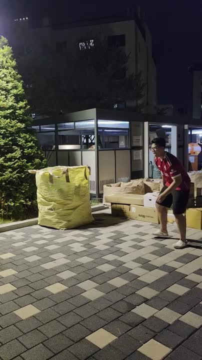 Boy Falls Onto Cardboard Boxes While Running Away With Ball