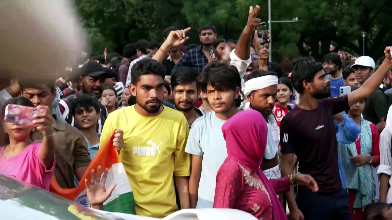 Thousands of protesters in Dehli calling for the resignation of Education Minister