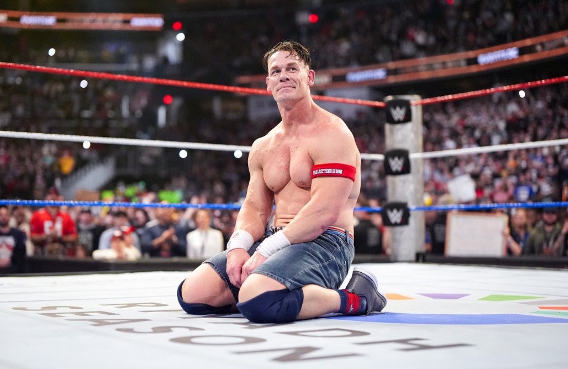 Does John Cena prefer wrestling or acting?