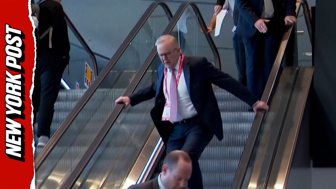 Escalator malfunction leaves Australia's PM stumbling and swearing